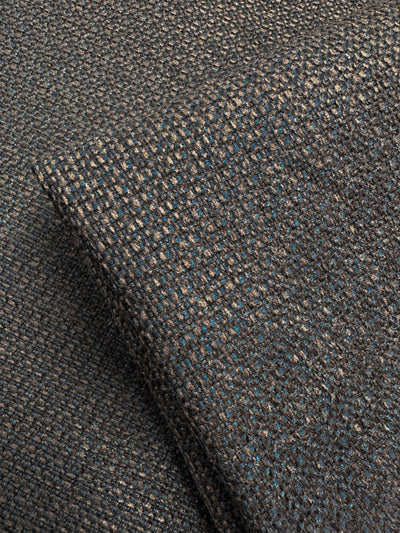 Close-up of Tuco 035 by Super Cheap Fabrics, a heavy-duty dark blue basket weave upholstery fabric. Its coarse pattern and subtle sheen create depth with gentle folds, exuding strength and elegance known for durability.