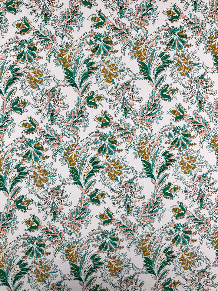 Designer Rayon - Verdant Script by Super Cheap Fabrics features a dense, intricate floral pattern with green, gold, and pink leaves on white rayon (145cm), perfect for vibrant, repeating botanical prints.