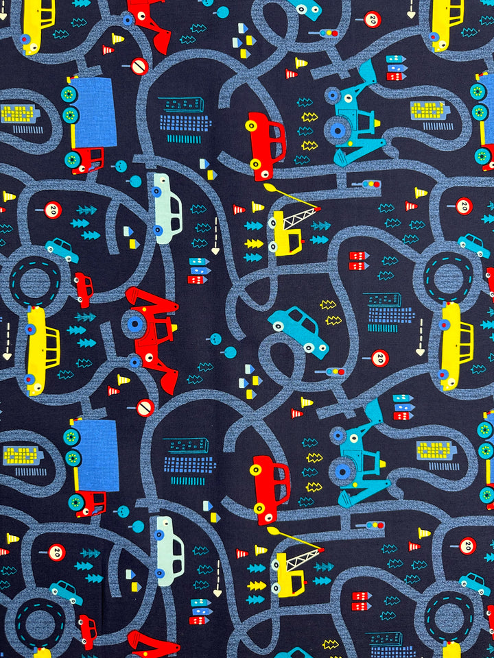 Super Cheap Fabrics presents "Traffic Jams," a printed cotton with colorful winding roads and vehicles on a dark background, ideal for multi-use textiles. Available in 112cm width, this fabric combines vibrant patterns with natural cotton fibers.