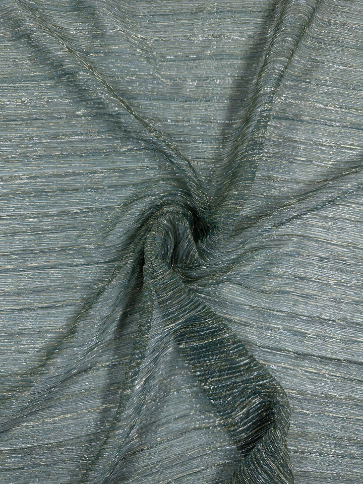 A close-up of the Metallix Pleat - Mermaid Glitter fabric from Super Cheap Fabrics showcases its crinkled, lightweight polyester in a muted green hue. Subtle metallic gold threads give it a shimmering effect. The fabric is artfully gathered into a small swirl at the center, accentuating its layered texture and sheen.