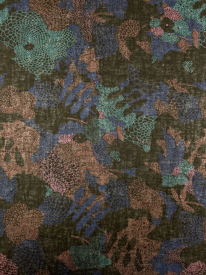 The Linen Blend - Coral - 147cm by Super Cheap Fabrics is a lightweight fabric with intricate teal, blue, and brown abstract motifs resembling leaves and scales on a multi-black background.