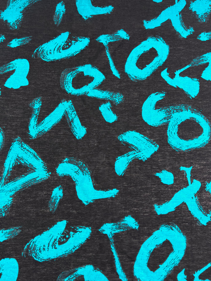 The Printed Cotton - Texter - 150cm from Super Cheap Fabrics features a black cotton base with artistic, abstract turquoise letters and shapes for an artistic graffiti-like pattern.