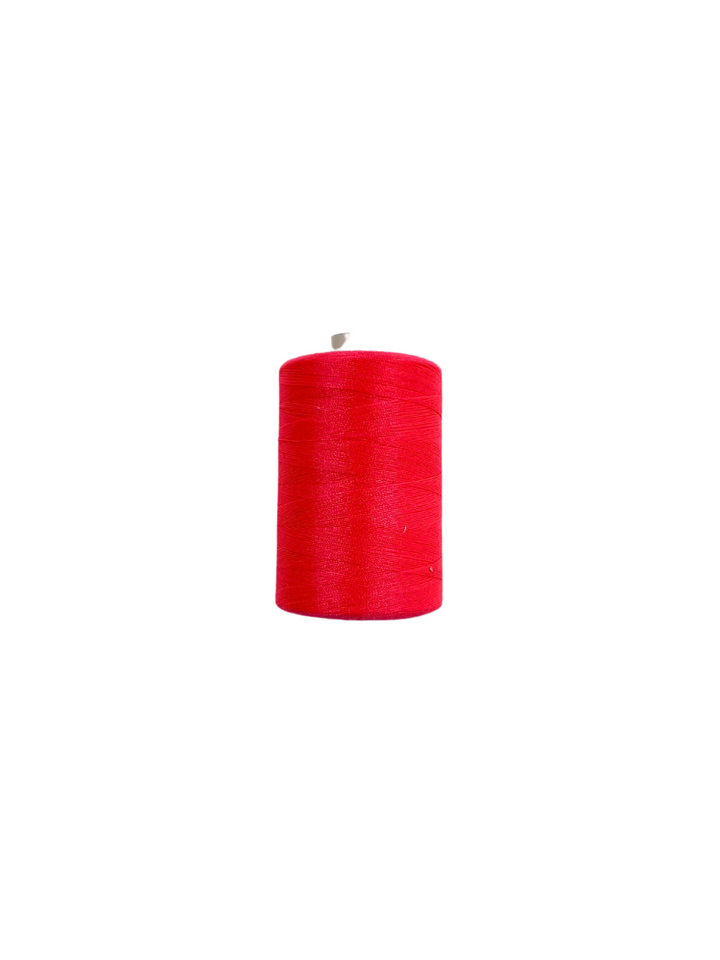 A spool of vibrant Fluro Pink sewing thread from Super Cheap Fabrics, spun polyester and measuring 1000 meters, is displayed against a white background. The thread is tightly wound on its cylindrical spool.