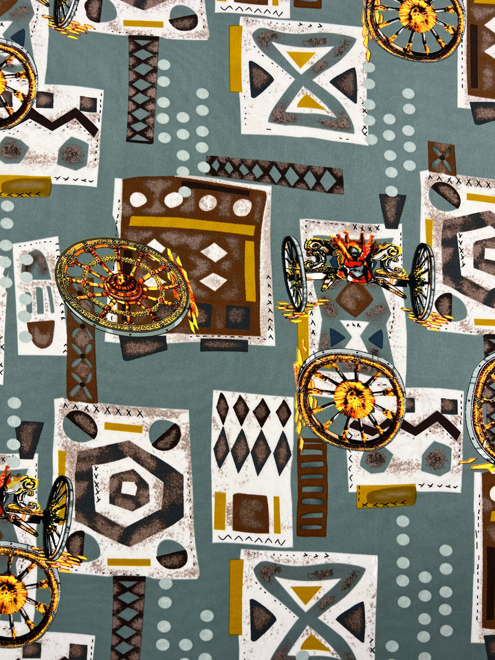 A complex, abstract pattern featuring geometric shapes, dots, lines, and other colorful elements spread across a greenish-gray background. The design includes starburst wheels, diamond shapes, and various rectangles in shades of brown, yellow, black, and white—perfect for versatile fabrics like the Deluxe Print - Medieval - 150cm by Super Cheap Fabrics.